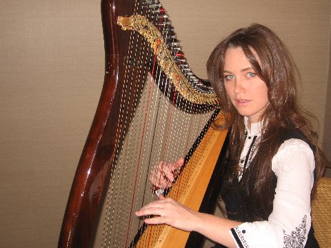 Corina playing the harp at a private function.