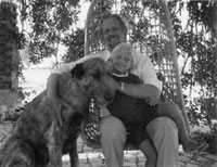 Ron and his son Damian under a Carob tree in Portugal